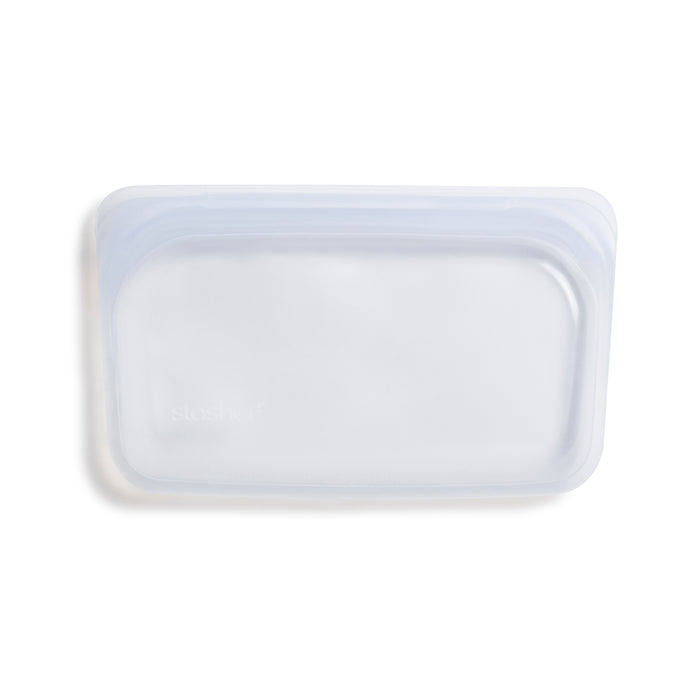 The Stasher Reusable Silicone Snack Bag, a transparent rectangular pouch made from premium food-grade silicone with a resealable top, is shown on a plain white background.