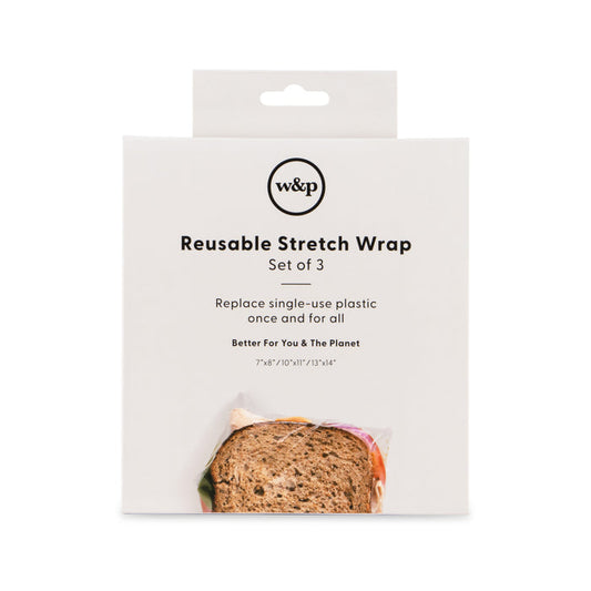 The product packaging for W&Ps Reusable Silicone Stretch Wrap, a set of three, highlights the transition to silicone wrap over plastic alternatives. The white box includes text and a partial image of a sandwich wrapped in the product at the bottom.