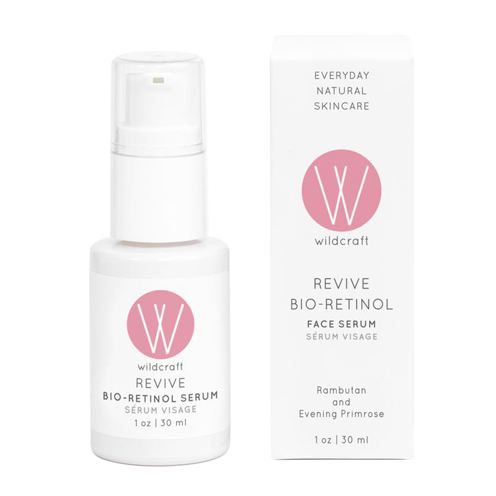 A white bottle and box of Wildcrafts Revive Bio-Retinol Face Serum, showcasing a pink logo, offer 1 oz (30 ml) of nourishing care. Featuring rambutan and evening primrose, this plant-based retinol alternative promotes ultimate skin revitalization.