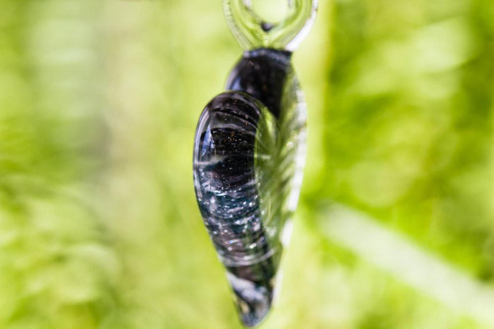 Ripple heart glass pendant infused with cremation ashes in teal green swirls