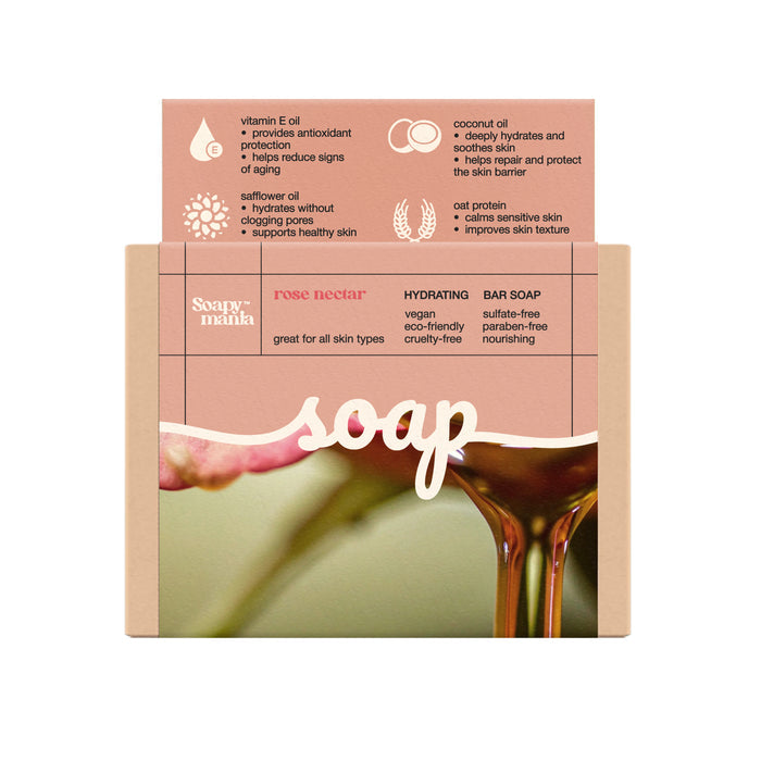 Soapymania’s Rose Nectar Hydrating Bar Soap is handcrafted with natural vegan ingredients, packaged eco-friendly, and labeled vegan, cruelty-free, sulfate-free, and paraben-free—featuring golden liquid over a pink flower.
