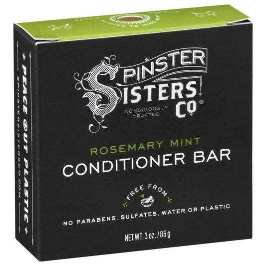 A green box by Spinster Sisters Co. contains the Rosemary Mint Conditioner Bar, a rosemary mint sulfate-free, eco-friendly product that is Fair Trade and free of parabens, water, and plastic. It features the phrase Peace Out Plastic on its packaging.