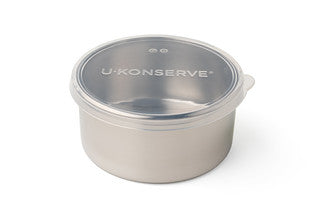 The U-Konserve Round Container Large is a sleek stainless steel food storage solution with a silicone lid, featuring white U-Konserve text, offering a plastic-free and modern design.