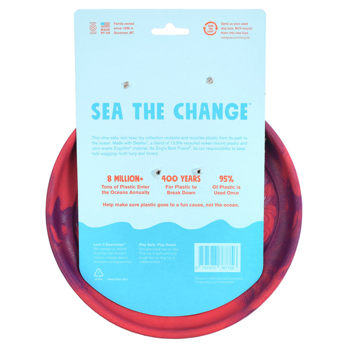The image displays packaging for West Paws Sailz® The Perfect Fetch Flyer Dog Toy, made from ocean-bound recycled plastic. It notes 8 million tons of plastic enter oceans yearly, taking 400 years to decompose, and 95% is used once. The frisbee is durable, lightweight with a blue background and red edges.