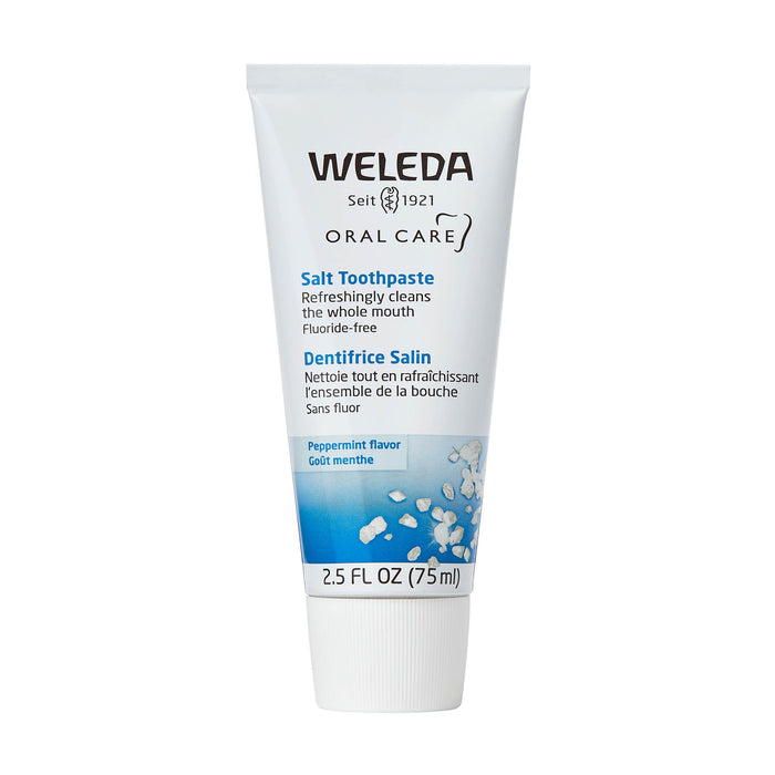 A 2.5 fl oz (75 ml) tube of Weleda Salt Toothpaste, featuring a white and blue design with English and French text, cleans the whole mouth fluoride-free, offering peppermint flavor combined with the natural benefits of Ratanhia root.