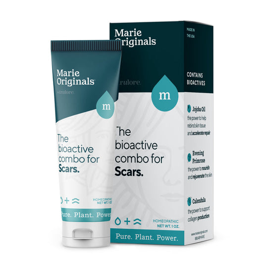 A tube and box of Marie Originals Scar Treatment Cream in teal and white packaging highlights natural ingredients like jojoba oil, evening primrose, and calendula for effective scar care. Labeled "The bioactive combo for Scars.