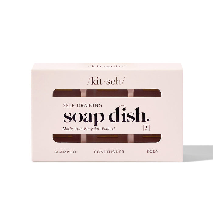 Introducing Kitsch’s Self Draining Soap Dish, beautifully presented in a rectangular white box with cut-out windows. Crafted from recycled plastic for Bottle-Free Beauty, this innovative design highlights our eco-friendly commitment.