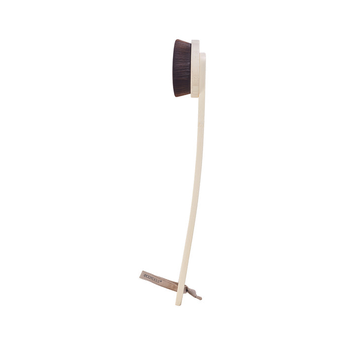 The EcoTools long-handled body brush with dark bristles is ideal for pre-tan exfoliating. Featuring a light beige handle and small hanging cord, it offers great grip and easy storage. Shown from the side, its perfect before using the Self-Tan Back Applicator.