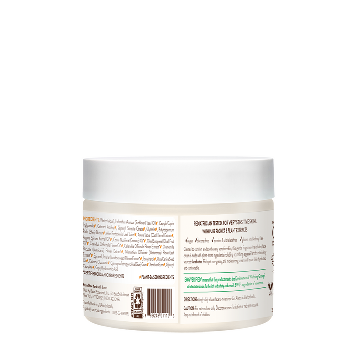The round white jar of Sensitive Baby Miracle Cream by Babo Botanicals lists ingredients on the side. The label highlights its fragrance-free formula, making it an ideal soothing baby moisturizer for sensitive skin with beneficial plant-based ingredients.