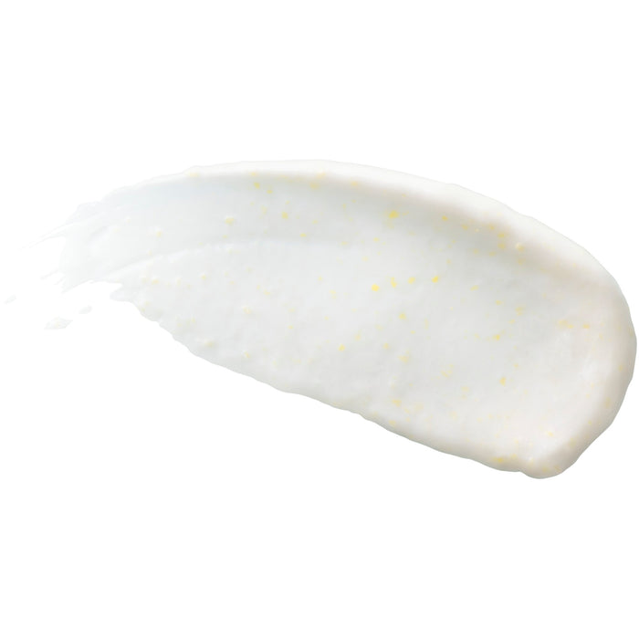 A smear of Burts Bees Sensitive Facial Cleanser with tiny yellow specks is spread in an arc on a plain white background.