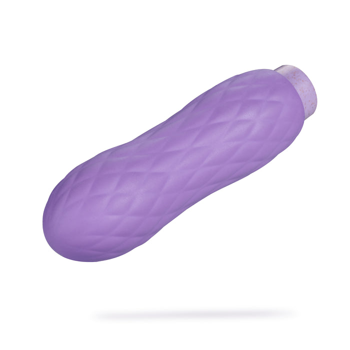 The Eco Bliss by Blush Gaia is a purple, textured squeeze bottle with a quilted pattern and round cap, set against a white background. Its both functional and waterproof, emphasizing eco-friendliness.