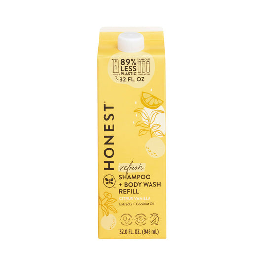 The Honest Companys Shampoo + Body Wash Carton Refill in a yellow carton features a citrus vanilla scent with coconut oil. Its tear-free formula reduces waste by using 89% less plastic and has charming lemon and orange illustrations on the 32 fl oz packaging.