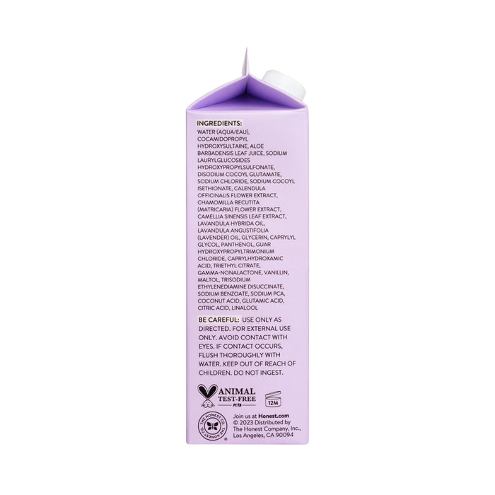 The image shows the back of a purple Shampoo+ Body Wash carton refill from The Honest Company, highlighting its focus on reducing waste. It includes ingredients, warnings, use directions, a caution against ingestion, confirms its animal test-free, and provides the brands website and address.