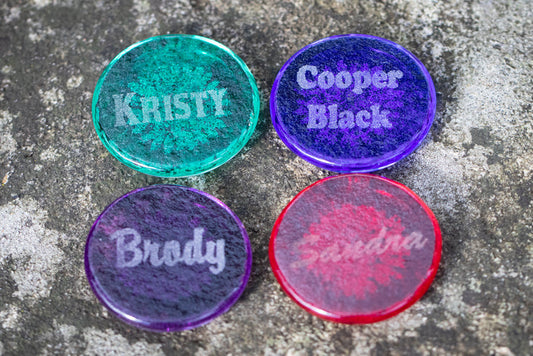 Collage of four round resin sharing stones showing turquoise white light yellow dusk blue rainbow and purple lime green