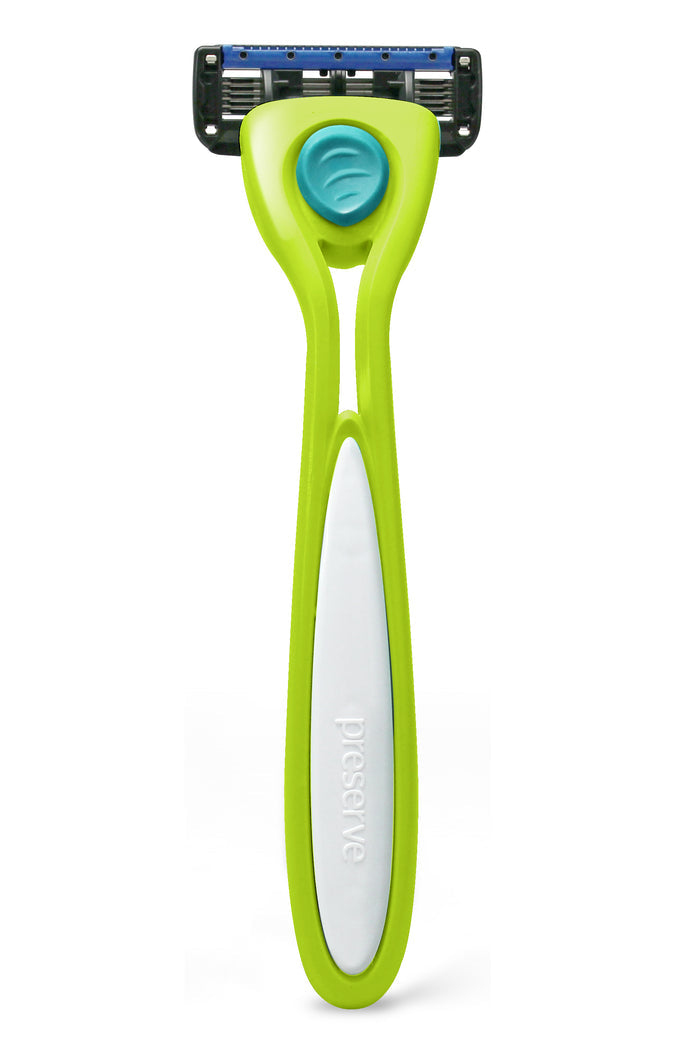 The Preserve Shave 5 Starter Set features a modern razor in bright green and white, made with recycled plastic. It has a sleek handle embossed with preserve, a blue button, and a pivoting head for flexibility. The razor includes multiple sharp blades for an effortless shave.
