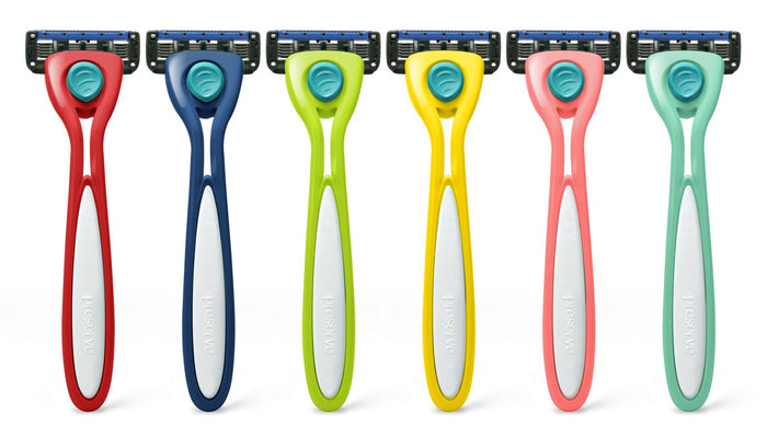 Six vibrant Preserve Shave 5 razors from the Shave 5 Starter Set are lined up vertically, each with a unique color: dark blue, red, lime green, yellow, pink, and teal. With ceramic-coated blades and Preserve on every white handle made of recycled plastic, they combine functionality with eco-friendliness.
