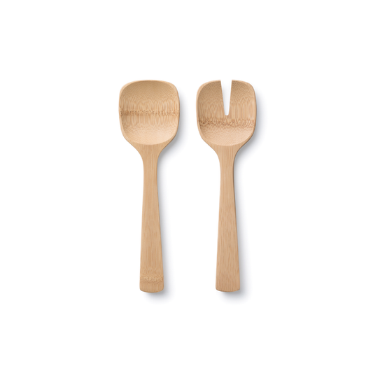 The Bambu Short Servers, crafted from organic bamboo, include a flat spoon with a shallow bowl and a modern fork with a split tip. Both feature short, rounded handles and rest stylishly on a white background.