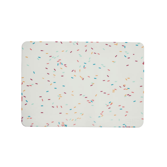 The GIR Silicone Baking Mat features a white background with multicolored, scattered sprinkles in blue, red, orange, and green. This eco-friendly kitchen essential combines style with sustainability for your daily cooking needs.