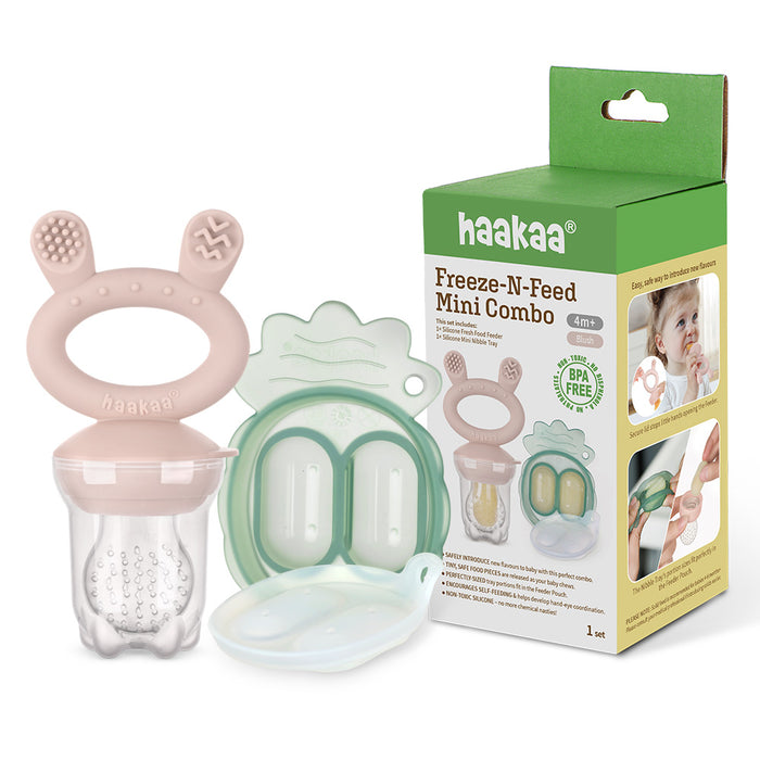 The Haakaa Silicone Freeze-N-Feed Mini Combo includes a pink silicone handle, clear mesh pouch for teething relief with frozen foods, and a mint green plastic case. The packaging showcases product details and an image of a baby using the feeder.