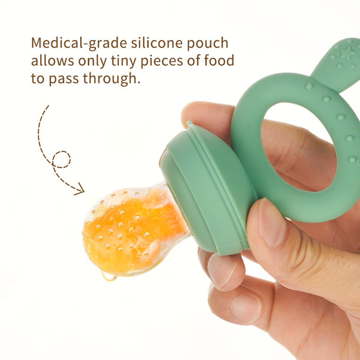 A hand holds a green silicone baby pouch with orange food inside. Text reads: "Medical-grade silicone pouch allows only tiny pieces of food to pass through.