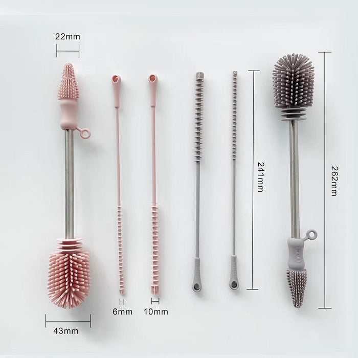 A set of five cleaning brushes with pink and gray silicone bristles and steel handles displayed vertically. Each brush has measurements labeled: 22mm, 43mm, 6mm, 10mm, 241mm, and 262mm.