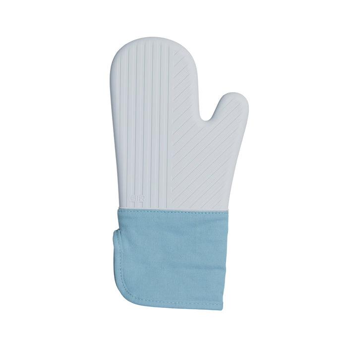 The GIR Silicone Oven Mitt is light blue with a darker blue cuff and features a textured, heat-resistant surface with diagonal lines for grip. Its thumb section offers hand protection from heat. BPA-free, it combines safety and style, making it an essential kitchen accessory.