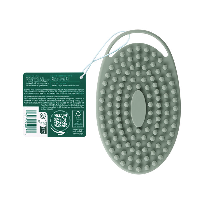 The EcoTools Silicone Scrubber is an eco-friendly, green oval pet grooming brush with rounded bristles and a comfortable handle. It includes a tag with product details and a QR code, ensuring gentle, cruelty-free grooming for pets.