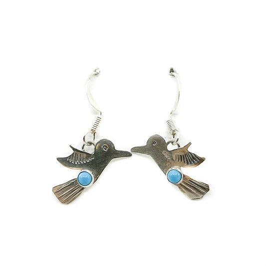 Made by Dine artist Lucille Platero
Delicate earrings with sterling silver and turquoise
Earrings are approximately .75 inches long x .75 inches wide and dangle .75 inches from earlobe
Sterling Silver wires