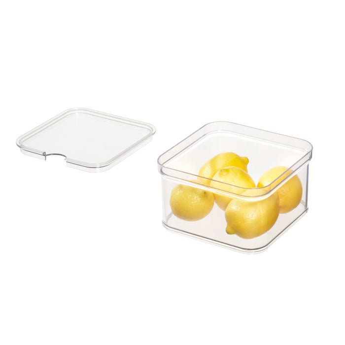 A clear square BPA-free recycled plastic fridge bin from iDesign holds six vibrant yellow lemons. With a durable lid set to the left, its perfect for refrigerator use.