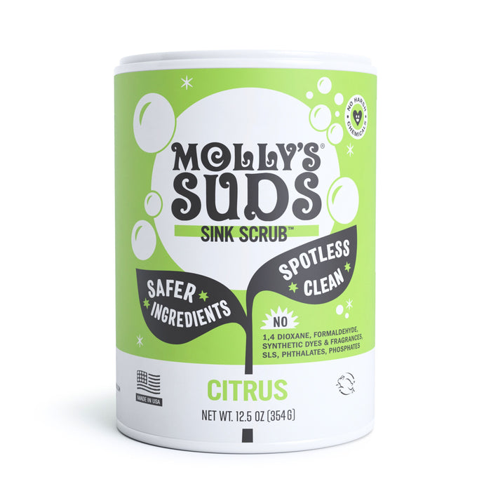 Mollys Suds Sink SCRUB™ in aromatic Citrus scent comes in a green and white 12.5 oz (354g) container. The label emphasizes Safer Ingredients, Spotless Clean, and absence of 1,4 Dioxane, Formaldehyde, Synthetic Dyes & Fragrances, SLS, Phthalates, and Phosphates.