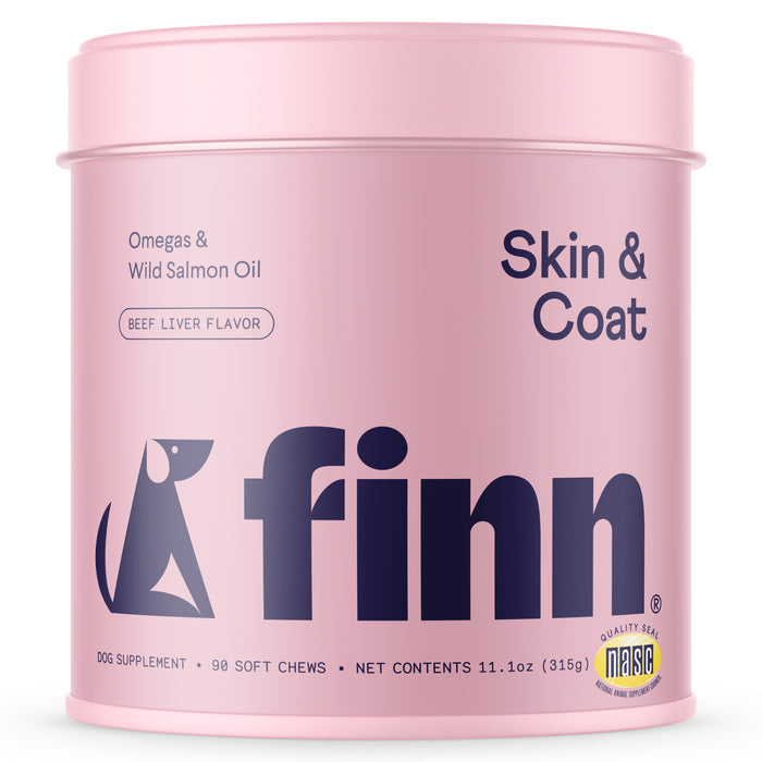A 316g pink container of Finns Skin & Coat Supplement for Dogs has 90 soft chews with omega-3s and Wild Salmon Oil, flavored with beef liver. It features a stylized dog logo and quality seal, promoting superior skin and coat health.