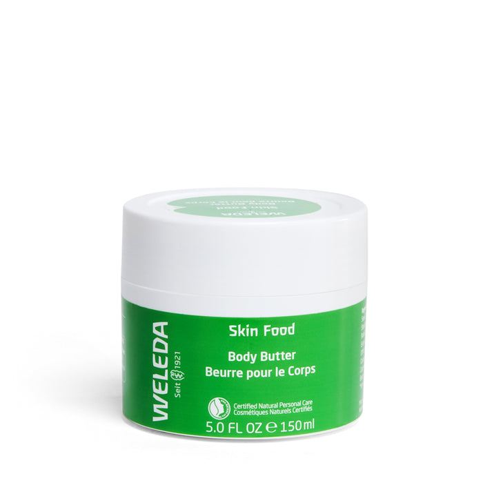 A 150 ml or 5.0 fl oz green and white jar of Weleda Skin Food Body Butter, infused with shea and cocoa seed butters, offers non-greasy hydration and is certified natural personal care, featuring clear product details.