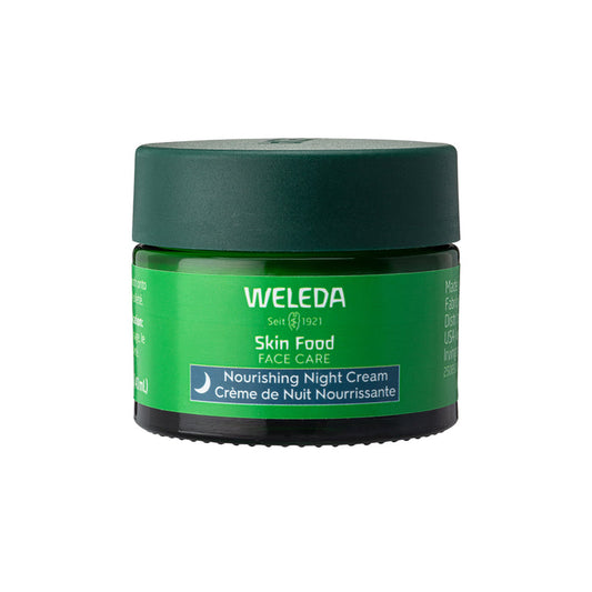 Weledas Skin Food Face Care Nourishing Night Cream comes in a small green jar with a dark lid. The label features English and French text, making it perfect for nourishing skin overnight and providing a rejuvenating face cream experience.