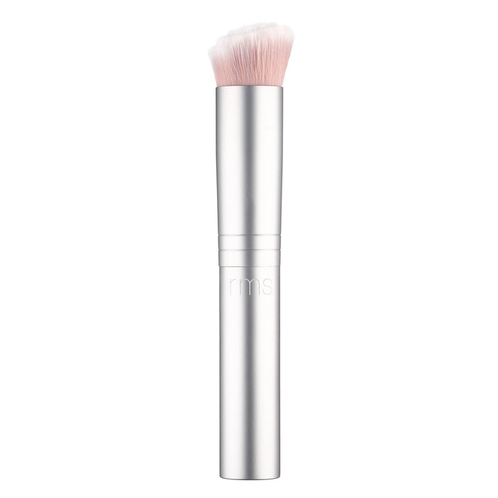 The RMS Beauty Skin2Skin Foundation Brush is sleek and silver with soft, dense white bristles and a cylindrical handle engraved with rms. It offers dual technology for seamless, flawless application of foundation or other cosmetics.