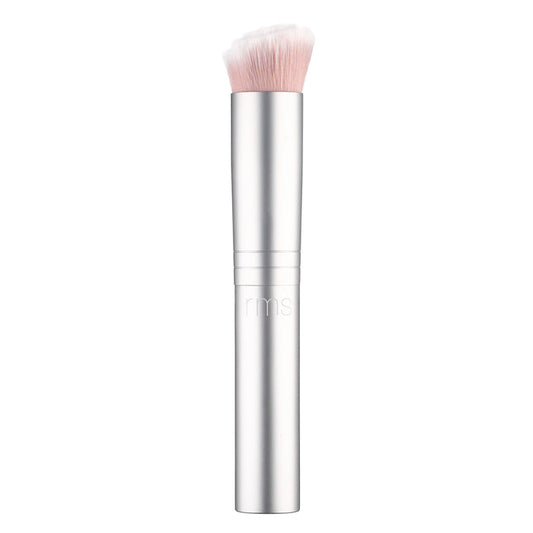 The RMS Beauty Skin2Skin Foundation Brush is sleek and silver with soft, dense white bristles and a cylindrical handle engraved with rms. It offers dual technology for seamless, flawless application of foundation or other cosmetics.