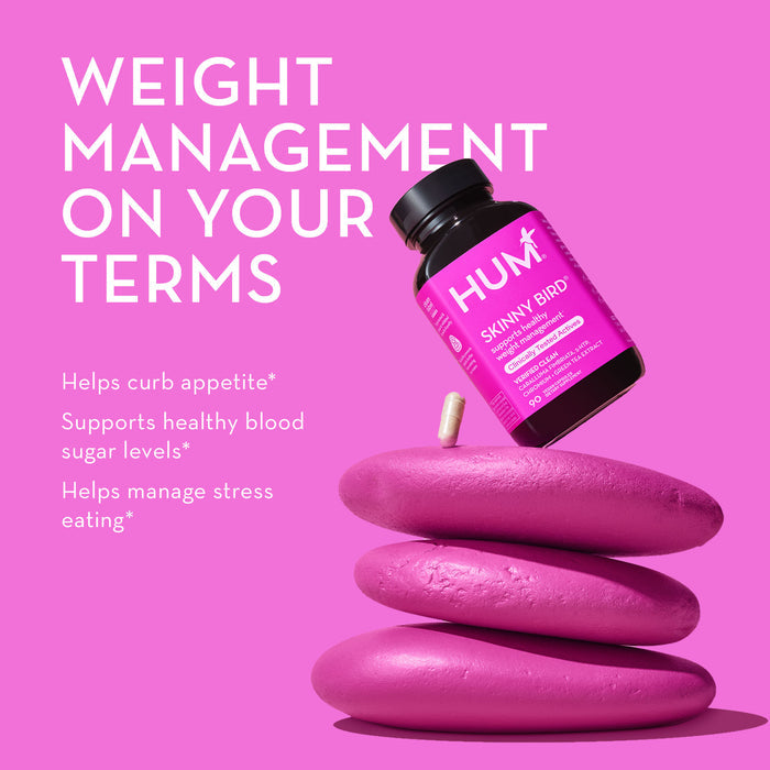 Image of a HUM Nutrition Skinny Bird weight management supplement bottle on a stack of pink stones on a pink background. White text on the left reads: "WEIGHT MANAGEMENT ON YOUR TERMS," followed by three bullet points listing benefits of the supplement.