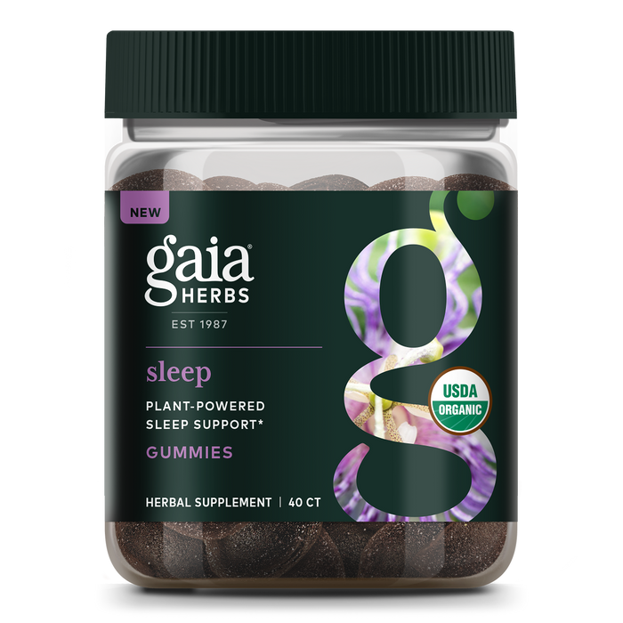 A jar of Gaia Herbs Sleep Gummies with a bold g on the label contains 40 gummies. The dark, botanically decorated label highlights USDA Organic, Plant-Powered Sleep Support, and calming Ashwagandha for restful sleep.