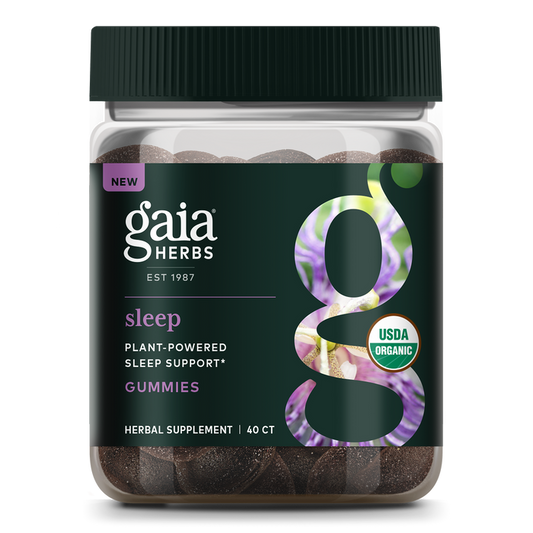 A jar of Gaia Herbs Sleep Gummies with a bold g on the label contains 40 gummies. The dark, botanically decorated label highlights USDA Organic, Plant-Powered Sleep Support, and calming Ashwagandha for restful sleep.