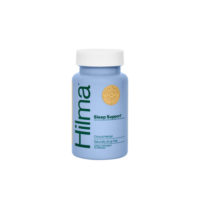 A Hilma Sleep Support melatonin-free capsule sits on a white background. The blue bottle with a white cap features a label highlighting it as a clinical herbal product and natural sleep aid, completely drug-free.