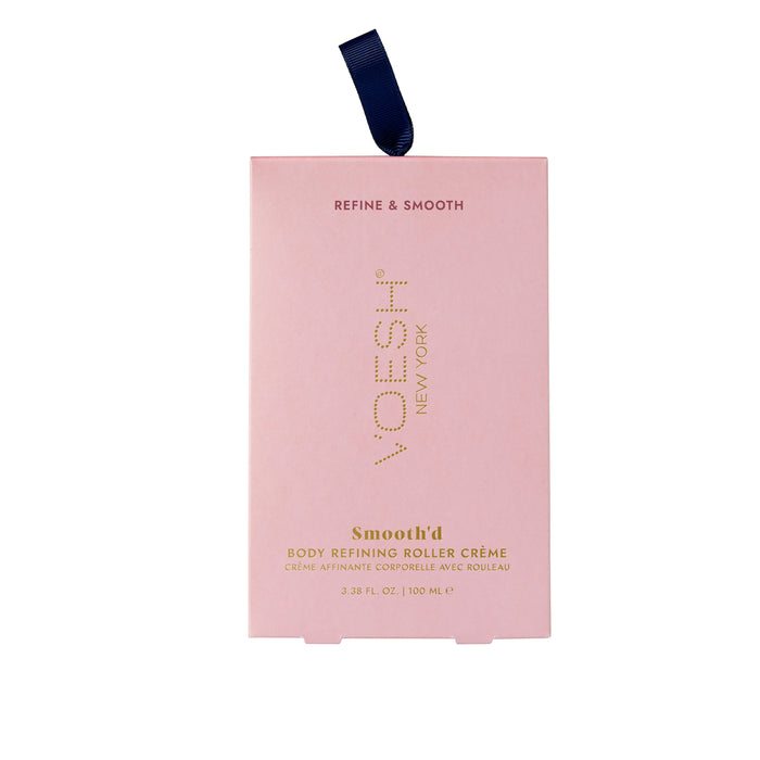 VOESH New Yorks Smoothd Body Refining Roller Crème, in pink rectangular packaging with a blue ribbon, is designed for crepey skin. It contains transforming hyaluronic acid and comes in a 3.38 fl. oz./100 mL size for smoother results.