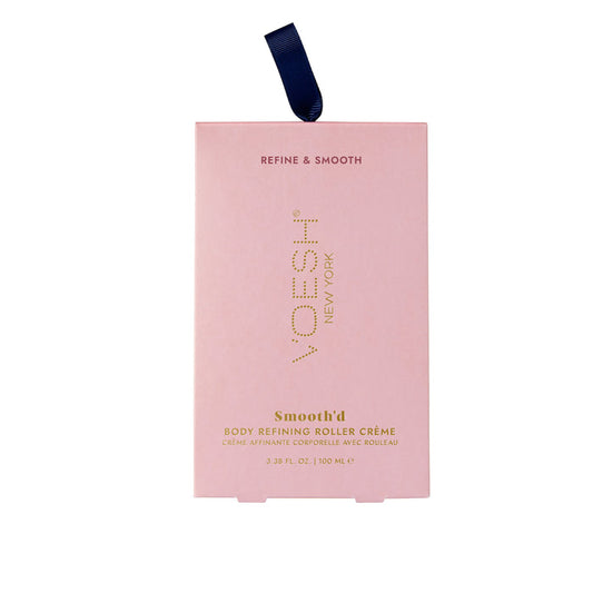VOESH New Yorks Smoothd Body Refining Roller Crème, in pink rectangular packaging with a blue ribbon, is designed for crepey skin. It contains transforming hyaluronic acid and comes in a 3.38 fl. oz./100 mL size for smoother results.