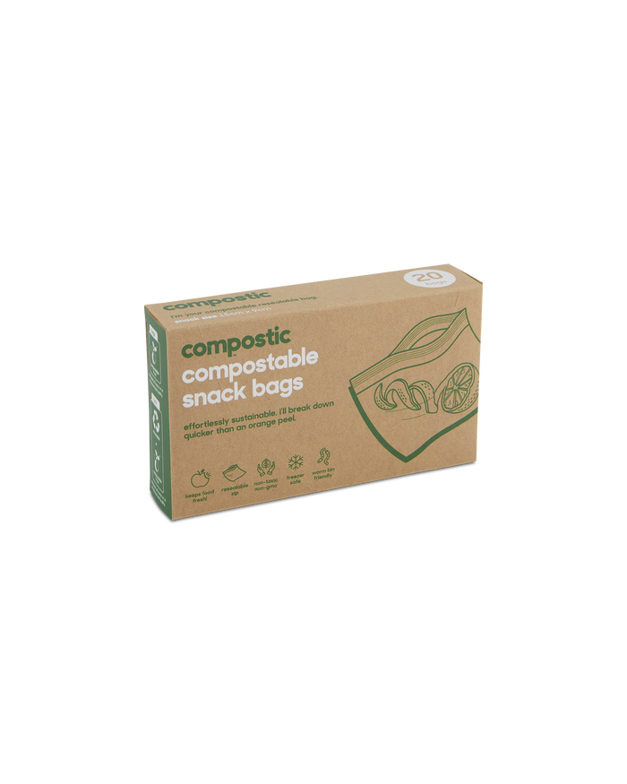 A box of Compostic Snack Bags contains 20 home-compostable bags made from renewable plant-based materials. The minimalist brown packaging is adorned with green text and fruit images, highlighting its eco-friendly nature.