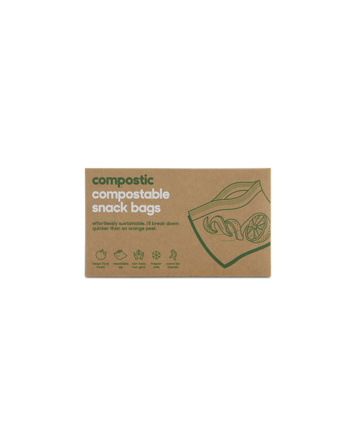 Compostics Snack Bags come in a cardboard box featuring green designs of a bag holding fruits, highlighting their sustainability with renewable plant-based materials. They are home-compostable and non-toxic, making them ideal for eco-friendly lifestyles.