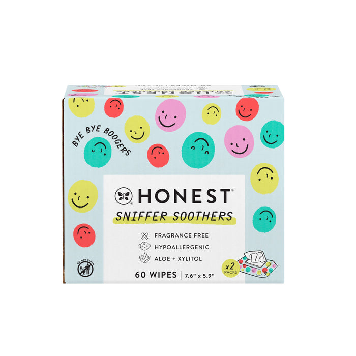 A box of The Honest Companys Sniffer Soothers Gentle Soothing Nose and Face Wipes sits on a white background, showcasing colorful, smiling circles. Its fragrance-free, hypoallergenic, dermatologist-tested, contains 60 wipes, and mentions soothing ingredients like aloe and xylitol.