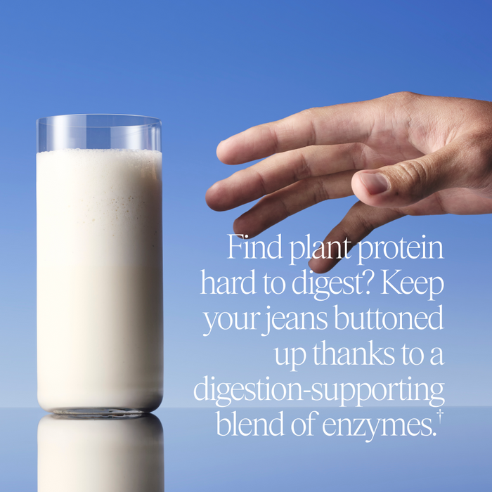 A hand reaches toward a glass of plant-based milk against a blue background. Text highlights easier digestion with Ora Organic’s So Lean & So Clean: Daily Active Plant Protein Powder, featuring enzymes and monkfruit for gentle, organic nutrition.