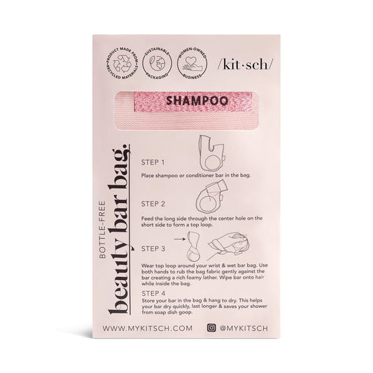 The Kitsch Soap Bar Bag showcases a pink shampoo bar in a handy hanging bag, perfect for streamlining your shower routine. It includes usage instructions and the brands social media handles, ensuring optimal airflow while keeping your essentials organized.