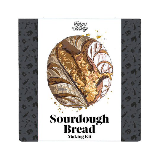 FarmSteadys Sourdough Bread Making Kit packaging features a golden crusted sourdough illustration and a backdrop of bread and baking tools, highlighting specialty equipment to perfect your bread.