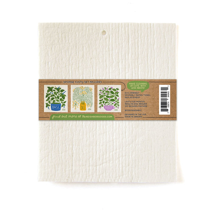 A Swedish Sponge Cloth from The Neighborgoods features herb illustrations like basil, dill, and mint with a brown eco-friendly label centered, highlighting cleaning uses and durability. A barcode is located on the right side of the label.
