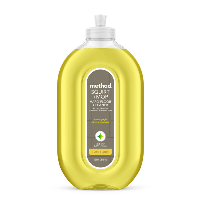 A clear bottle of method Squirt & Mop Hard Floor Cleaner with lemon ginger scent, containing yellow liquid and a gray label with green and white text. The flip-top cap cleaner is Leaping Bunny–certified and ideal for no-wax floors.