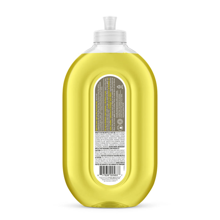 A clear plastic bottle of method Squirt & Mop Hard Floor Cleaner contains yellow liquid, features a transparent flip-top cap, and a back label with multilingual text, symbols, and a barcode. Leaping Bunny–certified, its perfect for no-wax floors. The bottle is centered on a white background.